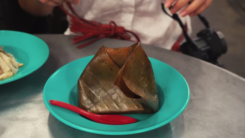 Street food otak otak at a vendor stall in Penang, Malaysia