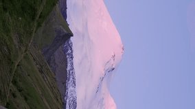 Vertical video. Mount Elbrus at dawn. Caucasus Mountains, Russia
