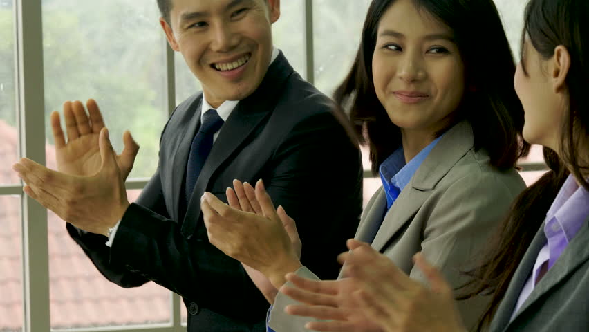 Business audience applauding after best seminar.