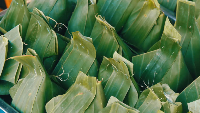 Products wrapped in banana leaves close up view