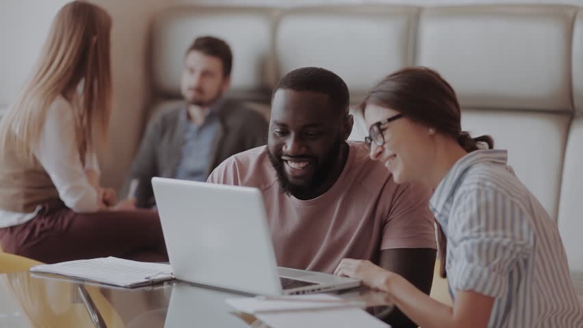 International team hapy with the resuts highfive male and female. Entrepreneurs.