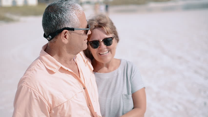 Happy Middle-Aged Couple Laughing, Kissing at the Beach Royalty-Free Stock Footage #1008137440
