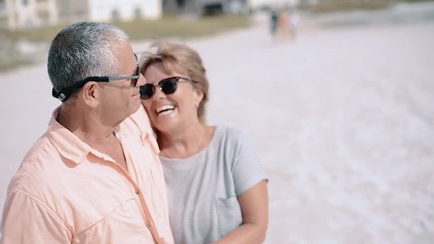 Happy Middleaged Couple Laughing Kissing Beach Stock Footage Video (100 