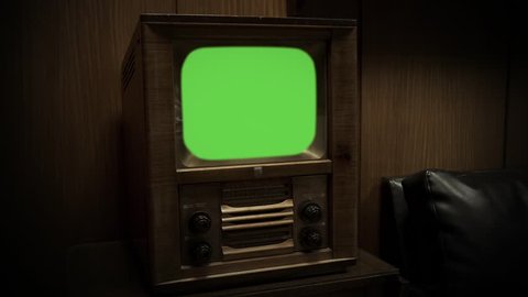 Old Wooden TV with Green Screen. Retro Tone. Zoom In. You can Replace Green Screen with the Footage or Picture you Want with “Keying” effect in After Effects (check out tutorials on YouTube).