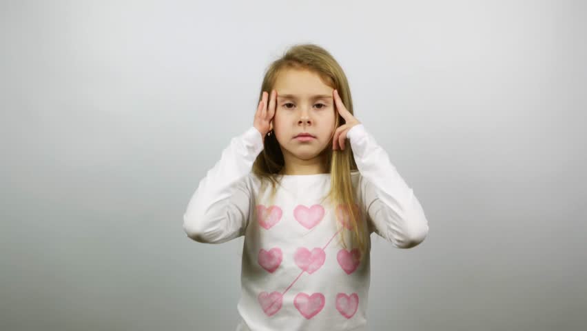 Nervous child trying to calm down. A little girl trying keeping calm in a stressful situation. Royalty-Free Stock Footage #1008149359