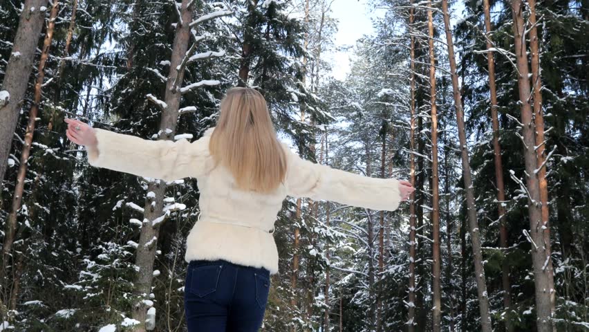 young happy woman breathing clean air of the park
