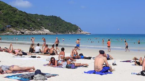 KOH PHANGAN, THAILAND - MARCH 02, 2018 : Haad Rin beach before the full moon party. Unidentified people arrived on the island of Koh Phangan, to participate in the Full Moon party 