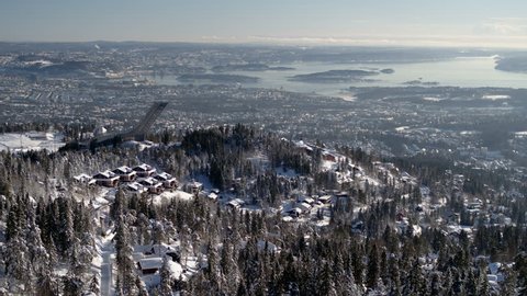 Drone shot behind Holmenkollen, view over Oslo, Norway, in