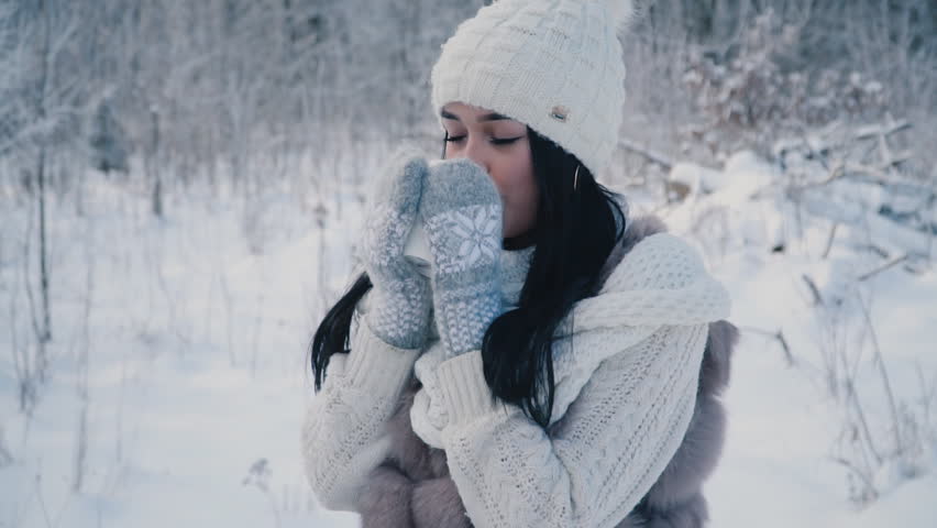 the girl is drinking tea