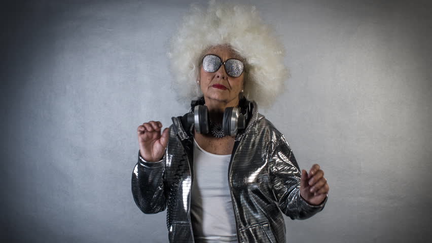An amazing grandma disco dancer, older lady partying in a disco setting Shu...