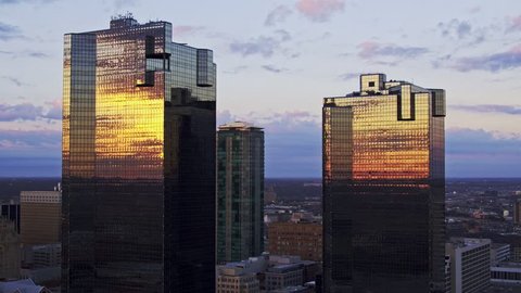 Fort Worth, Texas / USA - March 08, 2017 4K aerial footage of the sunrise reflecting on the buildings and skyline.