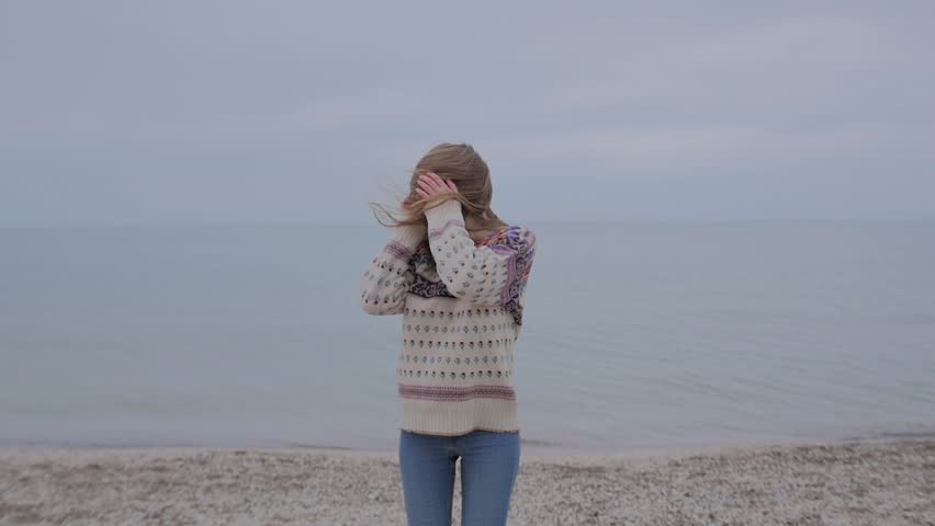 Beatiful Girl Smilling at the Autumn Beach