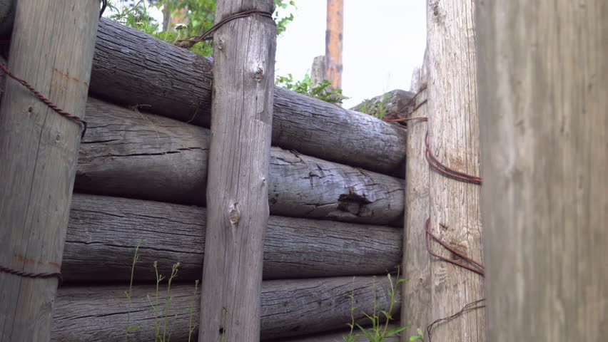 A wooden trench from the military foose in the forest being tied so well together