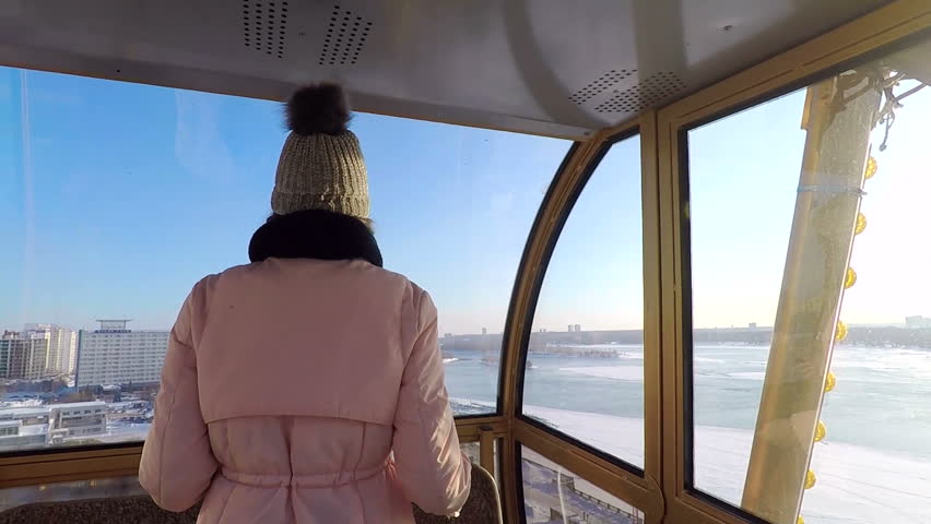 The girl turns and smiles into the camera. Hair braided in pigtails fly in the air in slowmo. A young adult girl turns and flirts with the camera sending air kisses in a slow-mo shot.