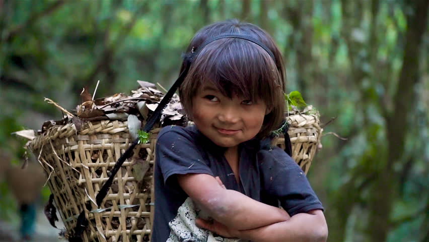 The little girl works as a porter. Children must work to earn some money for the family, in Nepal Royalty-Free Stock Footage #1008217783