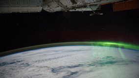 Planet Earth view from space or ISS. The spacecraft is passing above earth with the Aurora Borealis visible. Elements of this image furnished by NASA on Mac 10, 2012 from http://eol.jsc.nasa.gov. Tilt