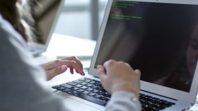 Close up shot of primary school girl using laptop computer to type something in coding computer class - Powered by Shutterstock - Get 15% off with code: PIKWIZARD15