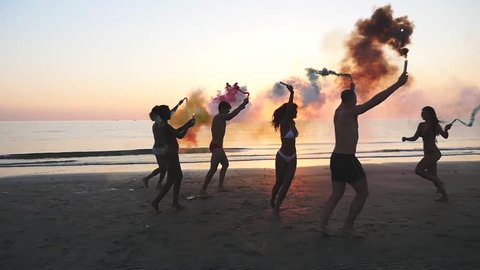 Group of friends having fun on the beach 