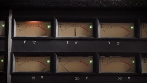old displays of professional analog vu metres in a recording studio, measuring and showing decibels