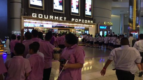 BANGKOK - DECEMBER 2017: Lots of schoolchildren queue up to a snack bar of Paragon Cineplex in the Siam Paragon shopping mall. With 16 screens and 5,000 seats, it is Thailands largest movie theater.