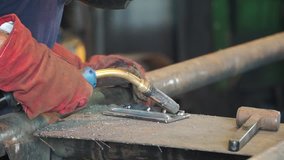 Industrial Worker at the refinery welding close up. Metal sawing close up. Clip. Close-up of welder working in workshop