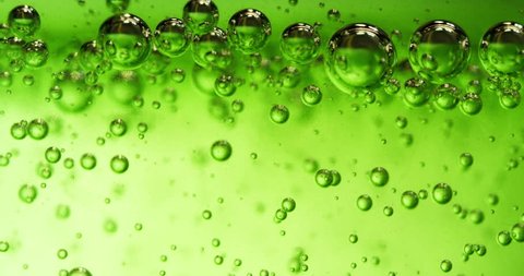 Extreme macro of green gel and intensive bubbles inside it. Video stock