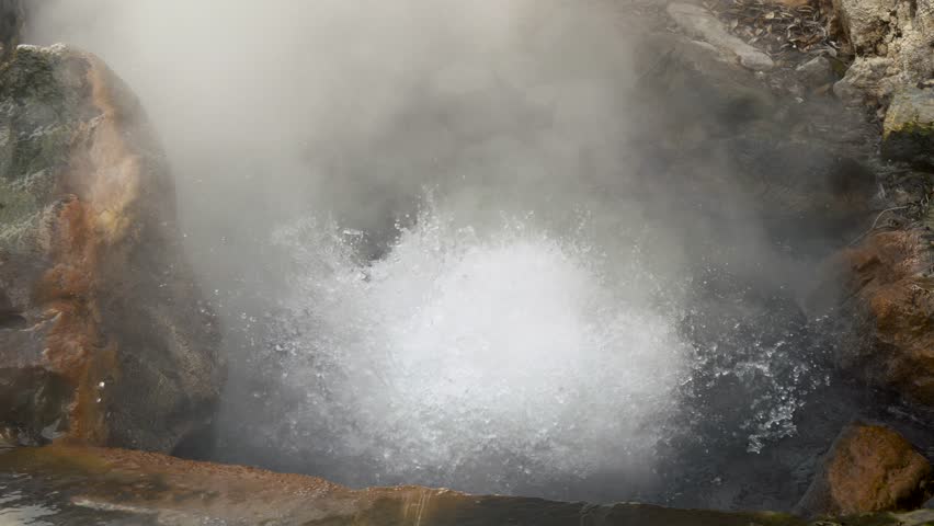 Natural hot spring. Slow motion shot of boiling water and evaporation. 4K, UHD