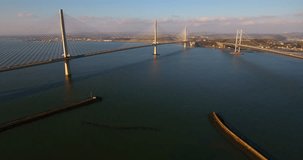 Aerial footage of the Queensferry Crossing, old Forth Road Bridge and the marina at South Queensferry.