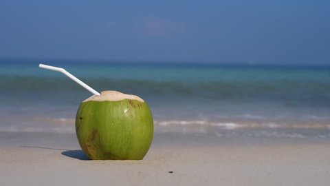 Green Coconut On The Beach By The Sea