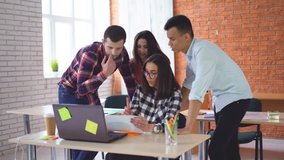 a group of young students sitting in the classroom and listening attentively to the teacher. University or school. A group of people mixed races. The girl invites classmates to look at the information - Powered by Shutterstock - Get 15% off with code: PIKWIZARD15
