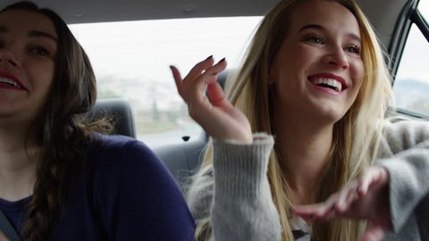 Fun Young Women Dance And Sing In Back Seat Of Moving Car- Shot On Red Scarlet-W Dragon In 4K/Slow Motion