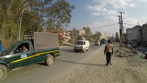 KATHMANDU, NEPAL - CIRCA FEBRUARY 2018: Traffic on Kathmandu ring road in Chabahil area.