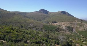 4K high quality summer day aerial footage of the Afrikaans Language Monument surroundings located on hill near Paarl and surroundings in wine making region of Western Cape near Cape Town, South Africa