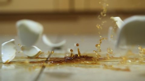 Cup of coffee shattering, bad luck in the morning, slow motion from 120 FPS capture