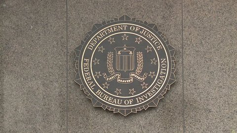 Shot of an Emblem with Department of Justice and Federal Bureau of Investigation inscribed on it at the United States FBI Building in Washington, D.C.  Recorded November 14, 2017.