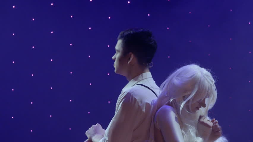 Young in love teenagers show their sad love story on the stage in theatre