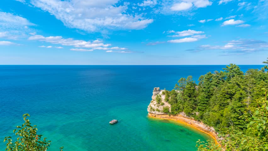 Time lapse video of Miners Castle Upper Peninsula of Michigan - floating clouds blue sky