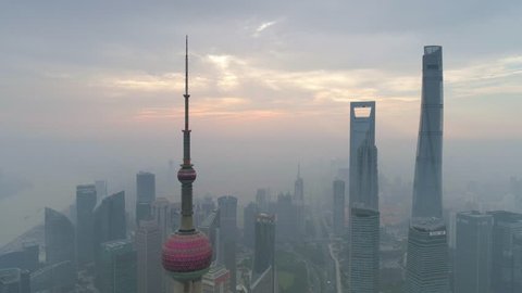SHANGHAI, CHINA - MAY 5, 2017: Aerial view video, business finance centre skyscrapers skyline, Huangpu river with bridge, historical and modern architecture, Bund, Pudong in the morning
