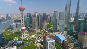 SHANGHAI, CHINA - MAY 5, 2017: Aerial view video, business finance centre skyscrapers skyline, Huangpu river with bridge, historical and modern architecture, Bund, Pudong