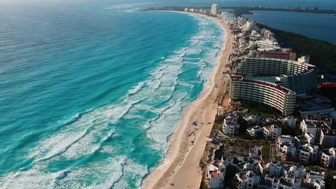 Aerial view of Cancun caribbean sea, the drone is flying upward