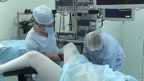 ukraine.kiev. 28.01.2018. medicine. gynecology. doctors prepare a woman for an operation on the labia. nurses lay the legs of a woman on a gynecological chair before the operation.