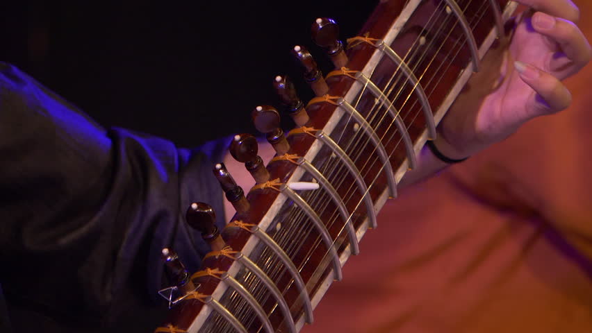 Hands of musician playing instrument Sitar shot in slow motion 100 fps. Royalty-Free Stock Footage #1008329416