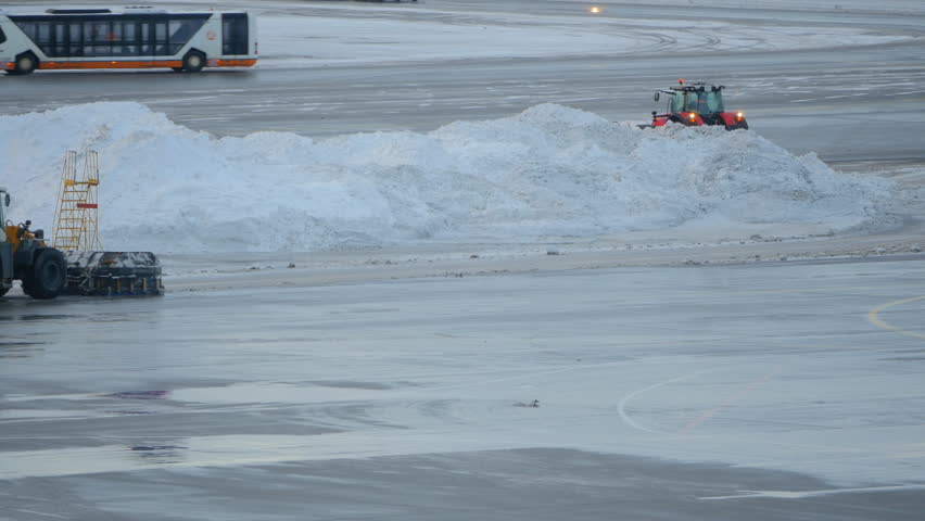Snowblower clearing snow in airport