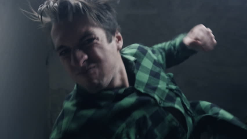furious aggressive man beats with his fists the lying person