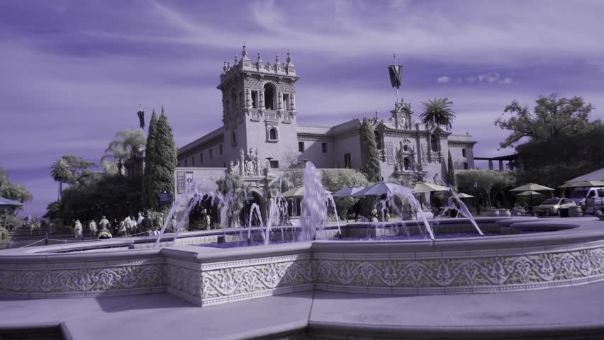 Steadicam turning around the fountain facing the Prado in an artistic coloring in Balboa Park in San Diego.
