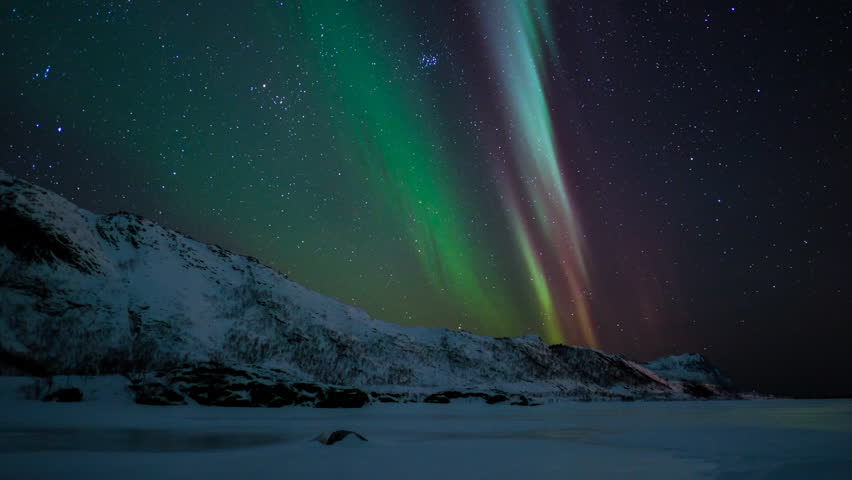 Time lapse clip of Polar Light or Northern Light (Aurora Borealis) in the night sky over the Lofoten islands in Northern Norway in winter.