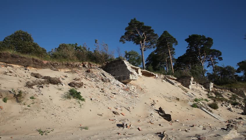 Pillbox on a beach, military buildings ruins, old russian fortress. Baltic sea, Latvia, Liepaja. World war 1