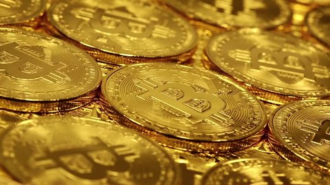 Blockchain technology, bitcoin mining concept, macro shot of rotating bitcoins. Crypto currency Gold Bitcoin, BTC, Bit Coin