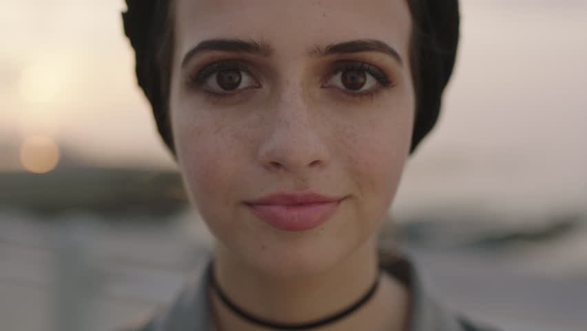 close up portrait of young girl with big beautiful eyes looking innocent gaze to camera