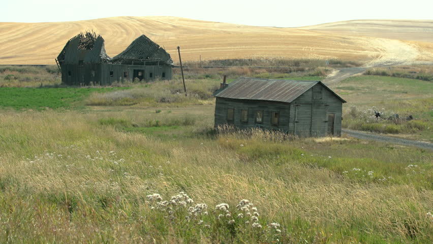 Abandoned buildings dot the landscape in the Palouse area of Washington State, USA. 4K. UHD.
